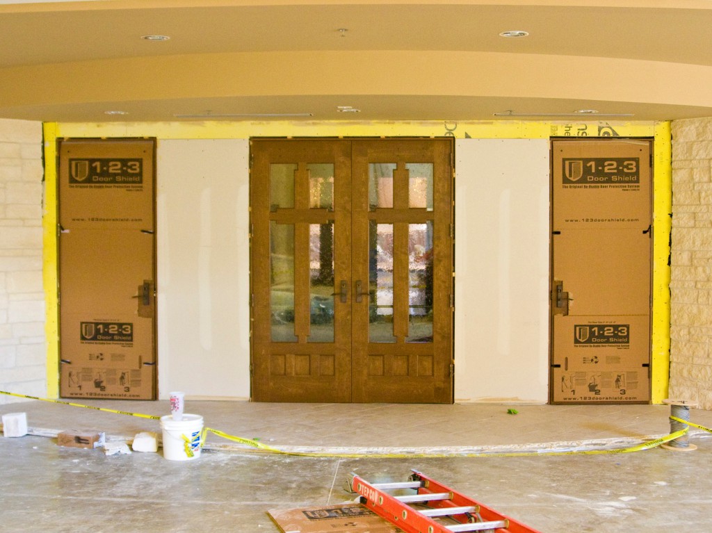 Installation of surface protection in a sanctuary hallway