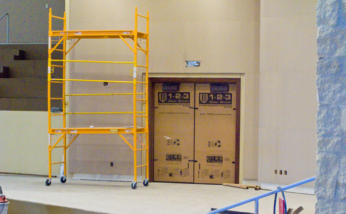 Door covered with a protective sheet from 1-2-3 Door Shield